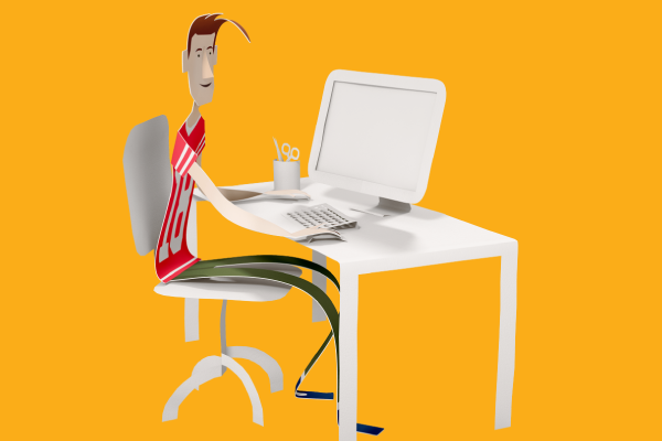 A man sitting at a desk, using a computer to check his enrolment.