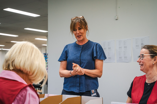 3 women having a conversation at an election office