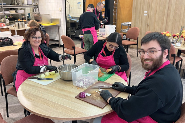 St-Marys-600-x-400 VEC staff cutting BBQ vegetables at a table together